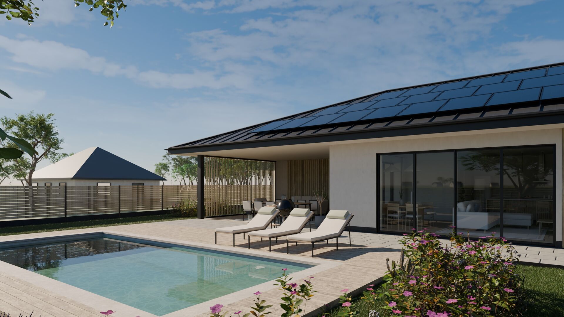 The covered terrace and the glass wall of the living room beyond the pool in raking afternoon sun.